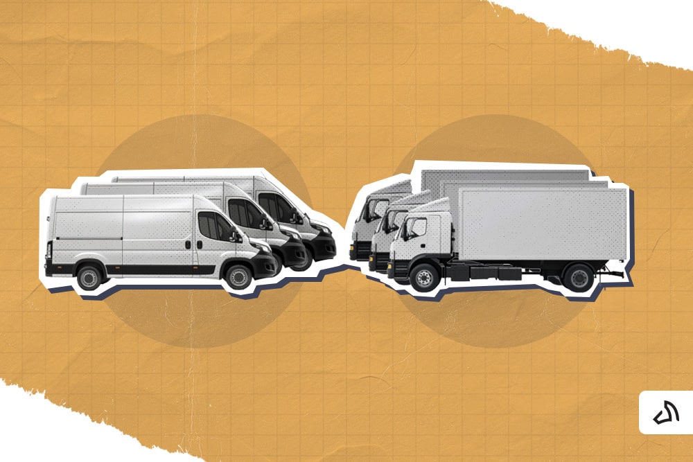 Three white delivery trucks facing three white delivery vans